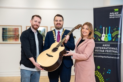 The Mayor of Ards and North Down, Councillor Alistair Cathcart with musicians Gary Lutton and Amanda Agnew, pictured at the launch of Ards International Guitar Festival’s 2025 programme.