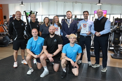 Deputy Mayor Cllr James Cochrane with staff from ANDBC Leisure service celebrate the Quest Excellent Accreditation